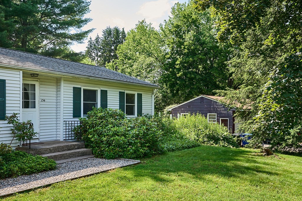134 Tracy Circle Amherst, MA 01002 - Photo 2 of 37 a view of a house with garden and yard