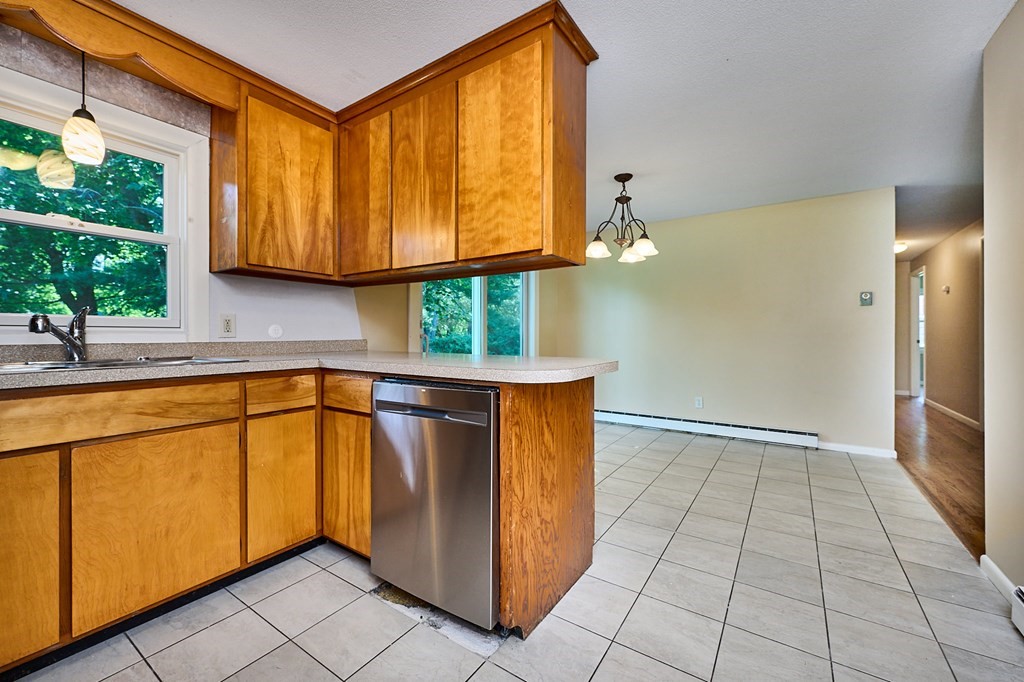 134 Tracy Circle Amherst, MA 01002 - Photo 6 of 37 a kitchen with stainless steel appliances granite countertop a refrigerator and a sink