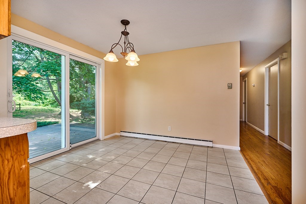 134 Tracy Circle Amherst, MA 01002 - Photo 8 of 37 an empty room with windows and outdoor view