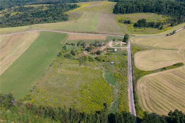 a view of a swimming pool with a yard