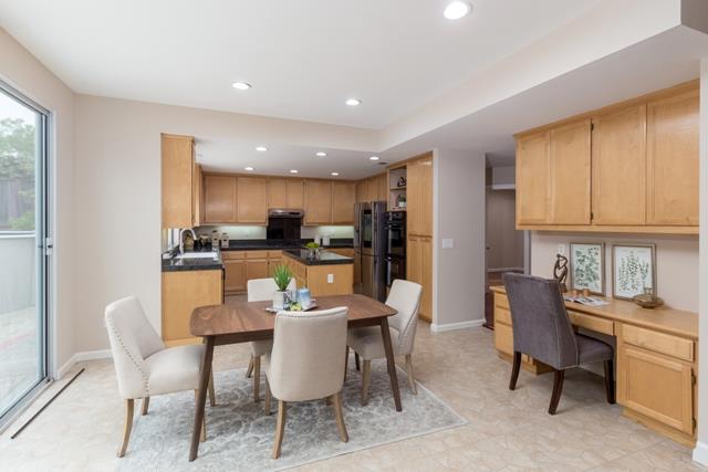 4597 Pacific Rim Way San Jose, CA 95121 - Photo 4 of 10 a dining room with furniture a kitchen view and appliances