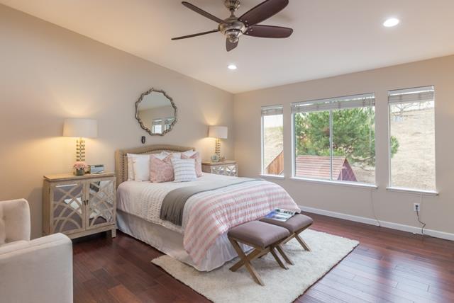 4597 Pacific Rim Way San Jose, CA 95121 - Photo 6 of 10 a bed room with a bed and a chandelier