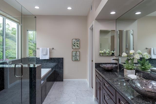 4597 Pacific Rim Way San Jose, CA 95121 - Photo 7 of 10 a kitchen with stainless steel appliances granite countertop sink a table and chairs in it