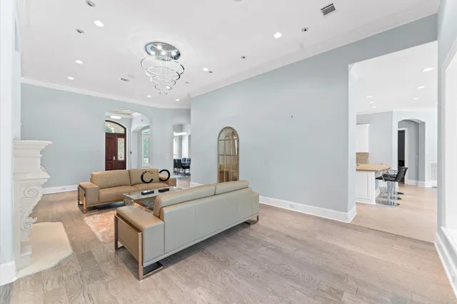 a large kitchen with stainless steel appliances granite countertop a large counter top and a stove top oven