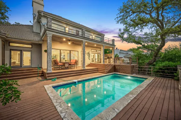 a view of a backyard with large trees
