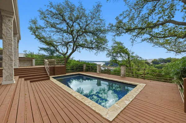an aerial view of residential house with outdoor space and swimming pool