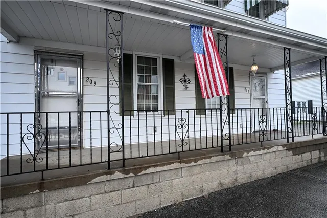 a view of a house with a small gate