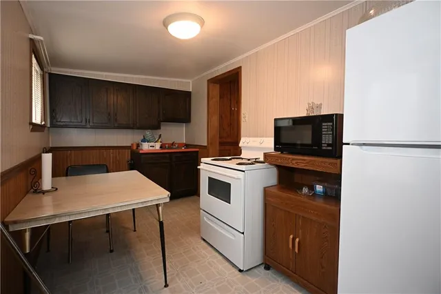 a kitchen with a stove and a microwave