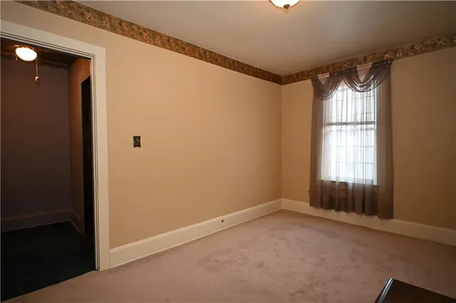 a view of an empty room and window