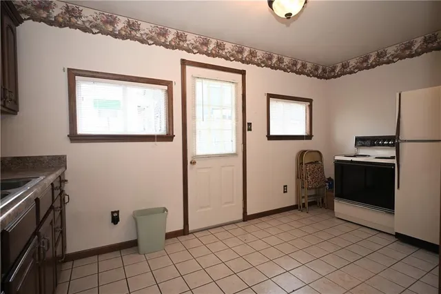a view of a kitchen with storage and utility