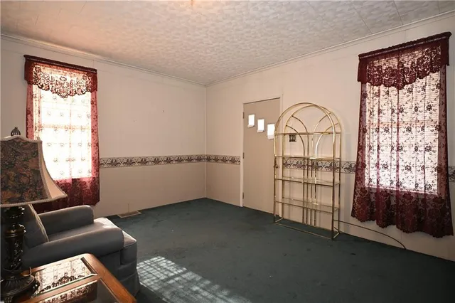 a view of livingroom with furniture and windows