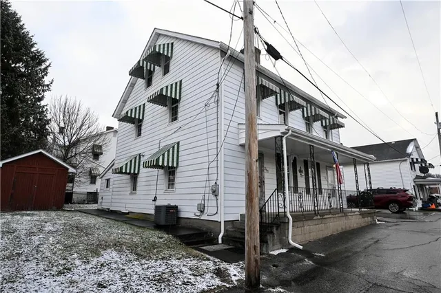 a view of a house with a street