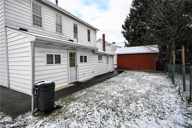 a view of a house with a backyard