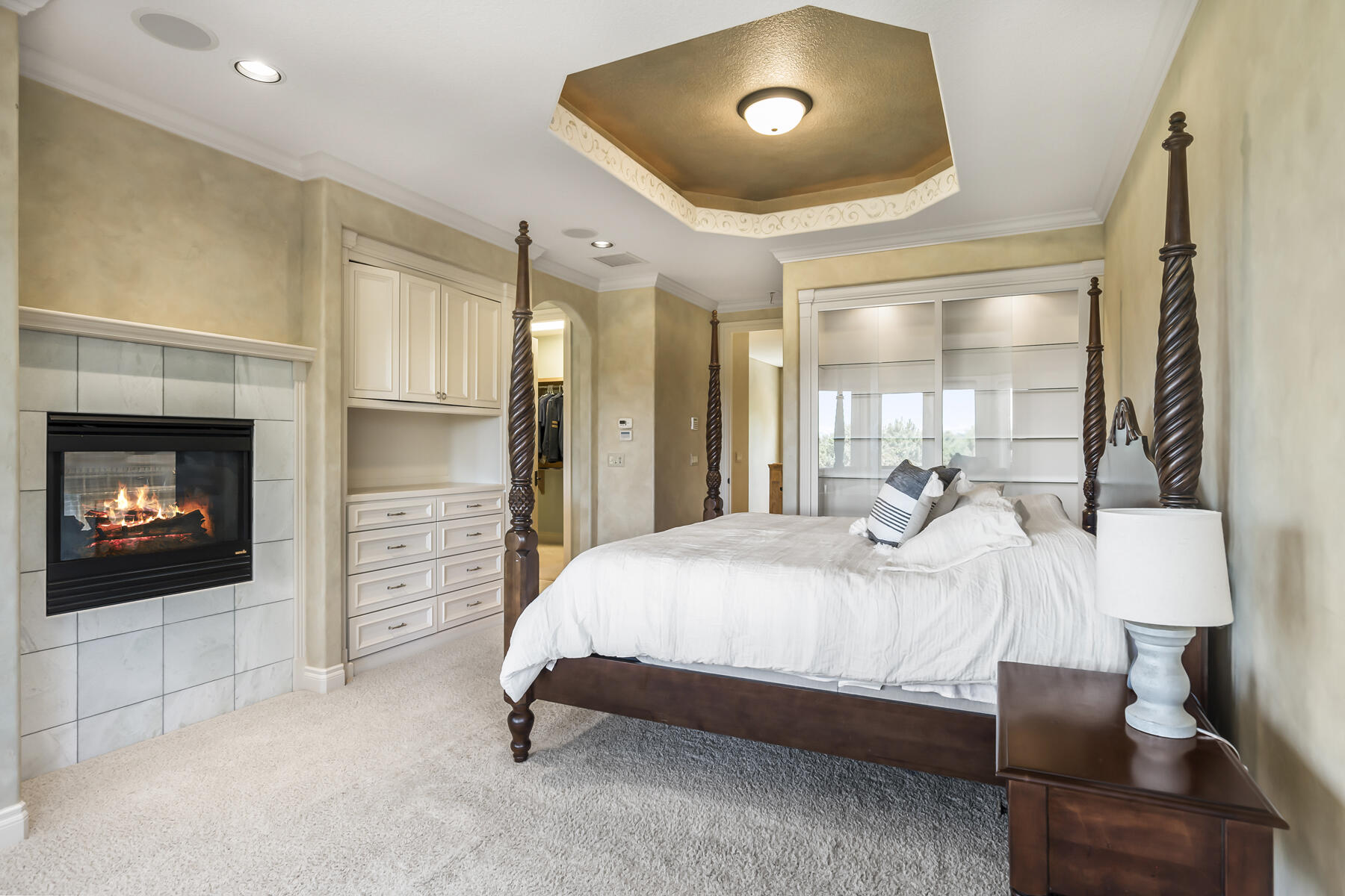 61445 Gosney Road Bend, OR 97702 - Photo 55 of 83 a bedroom with a bed and a fireplace