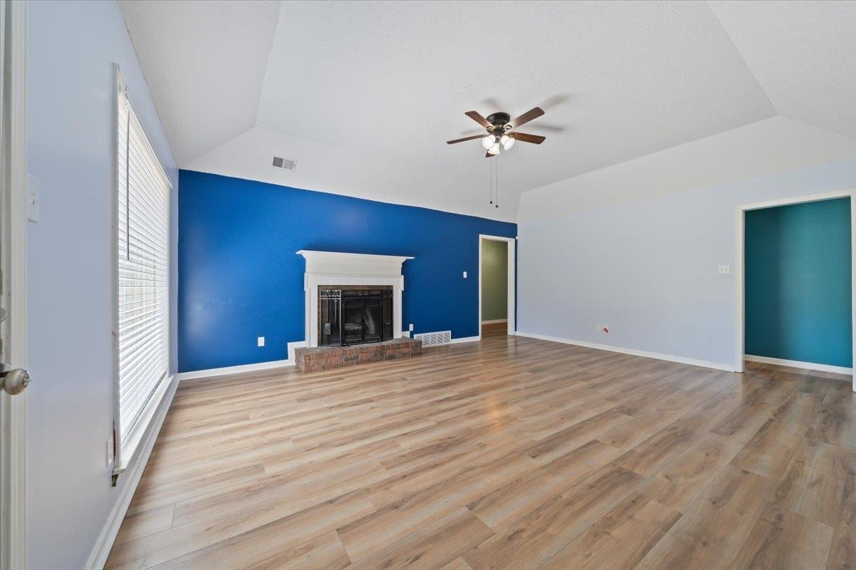 5399 Ross Road Memphis, TN 38141 - Photo 8 of 35 a view of empty room with wooden floor and fan