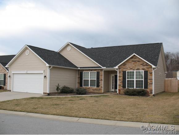 156 Pamlico Road Fletcher, NC 28732 - Photo 1 of 22 a front view of a house with a yard and garage