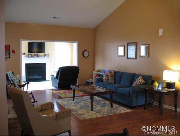 156 Pamlico Road Fletcher, NC 28732 - Photo 5 of 22 a living room with furniture and a fireplace