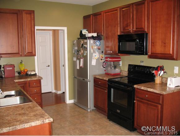 156 Pamlico Road Fletcher, NC 28732 - Photo 9 of 22 a kitchen with stainless steel appliances granite countertop a refrigerator and a stove top oven