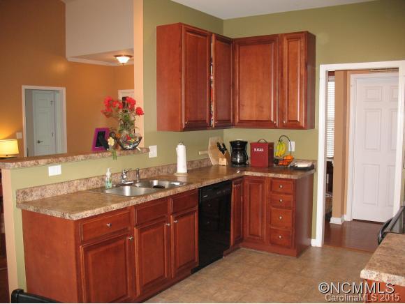 156 Pamlico Road Fletcher, NC 28732 - Photo 10 of 22 a kitchen with a sink and cabinets