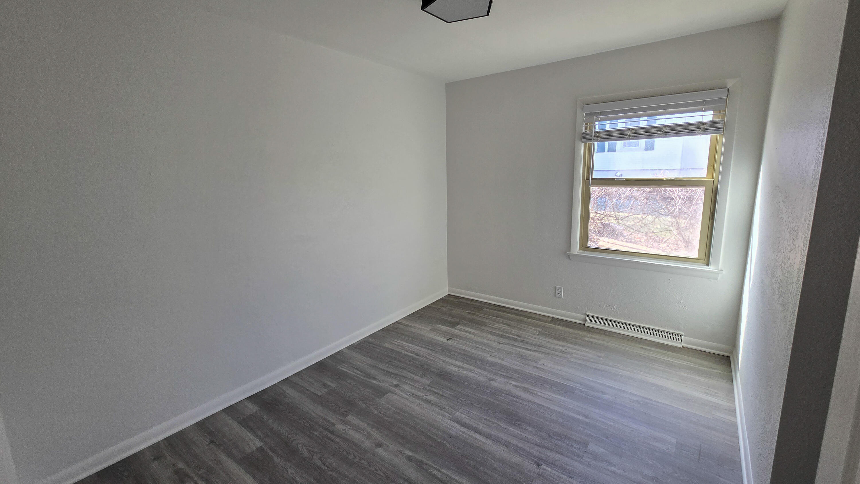 231 Prospect Avenue Pewaukee, WI 53072 - Photo 10 of 21 Lower Level 3rd Bedroom View 1