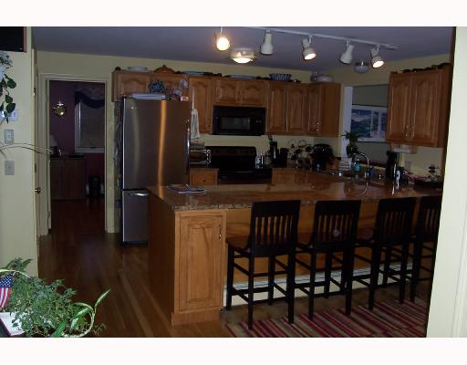 29 Duffield Road Bristol, RI 02809 - Photo 5 of 7 Kitchen. Granite counters, hardwood floors, stainless appliances, amana bottom freezer.