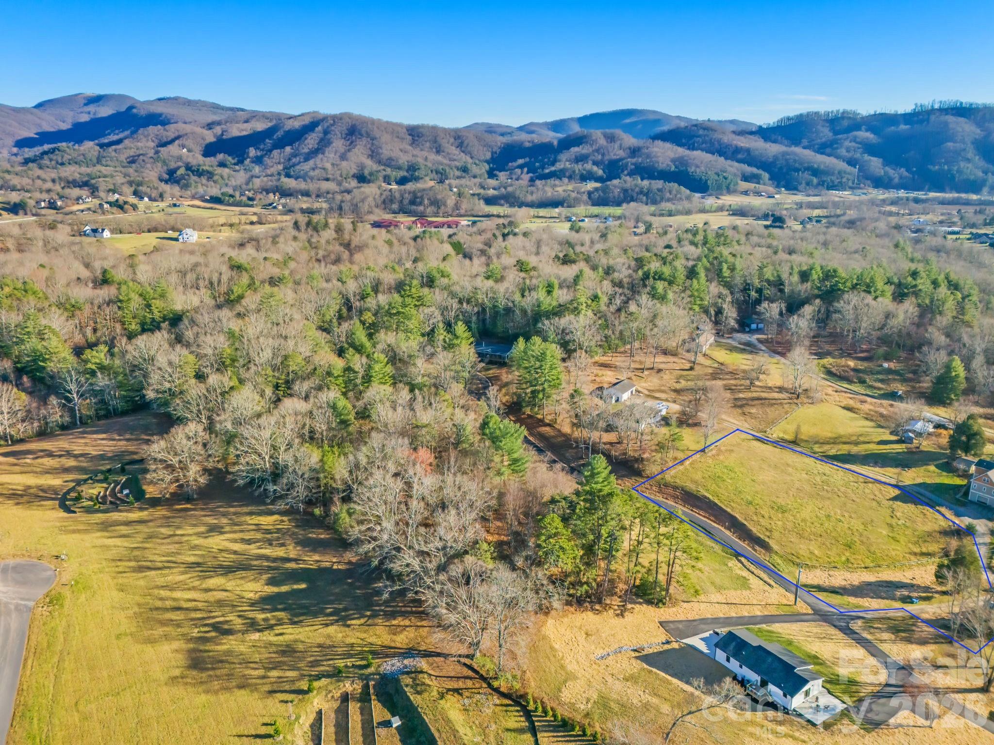 999 Terra Rdg Lane, Unit 3 Fletcher, NC 28732 - Photo 1 of 2 a view of a lake with mountains in the background