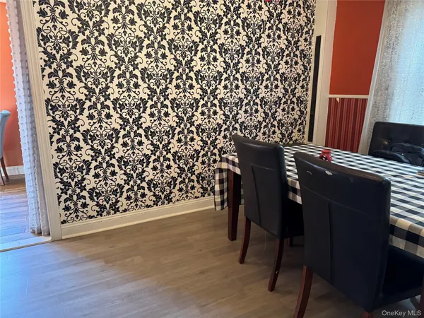 a wooden bench sitting in front of a window