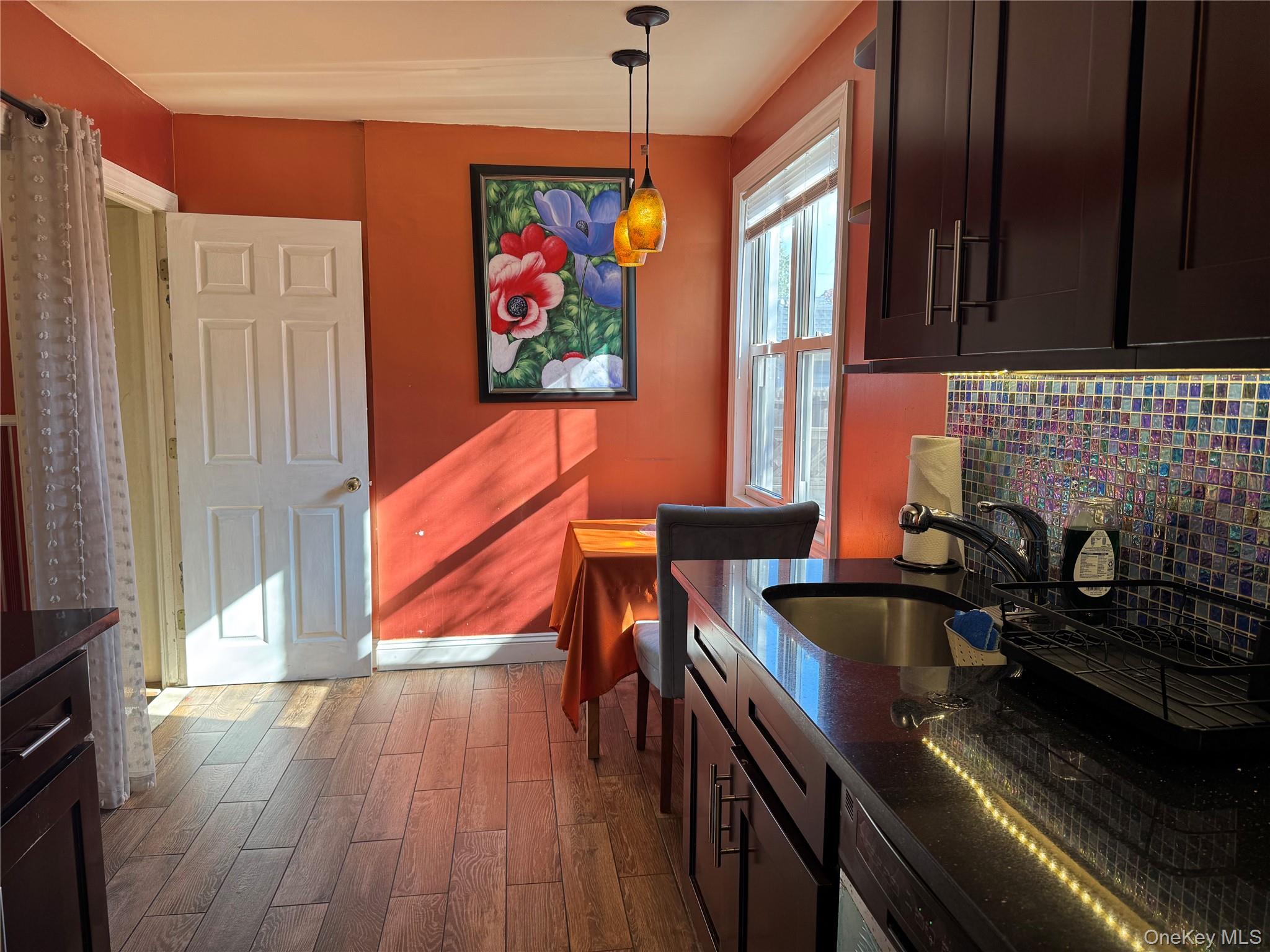 26 Parkside Drive Jericho, NY 11753 - Photo 13 of 25 a dining room with furniture a rug and wooden floor