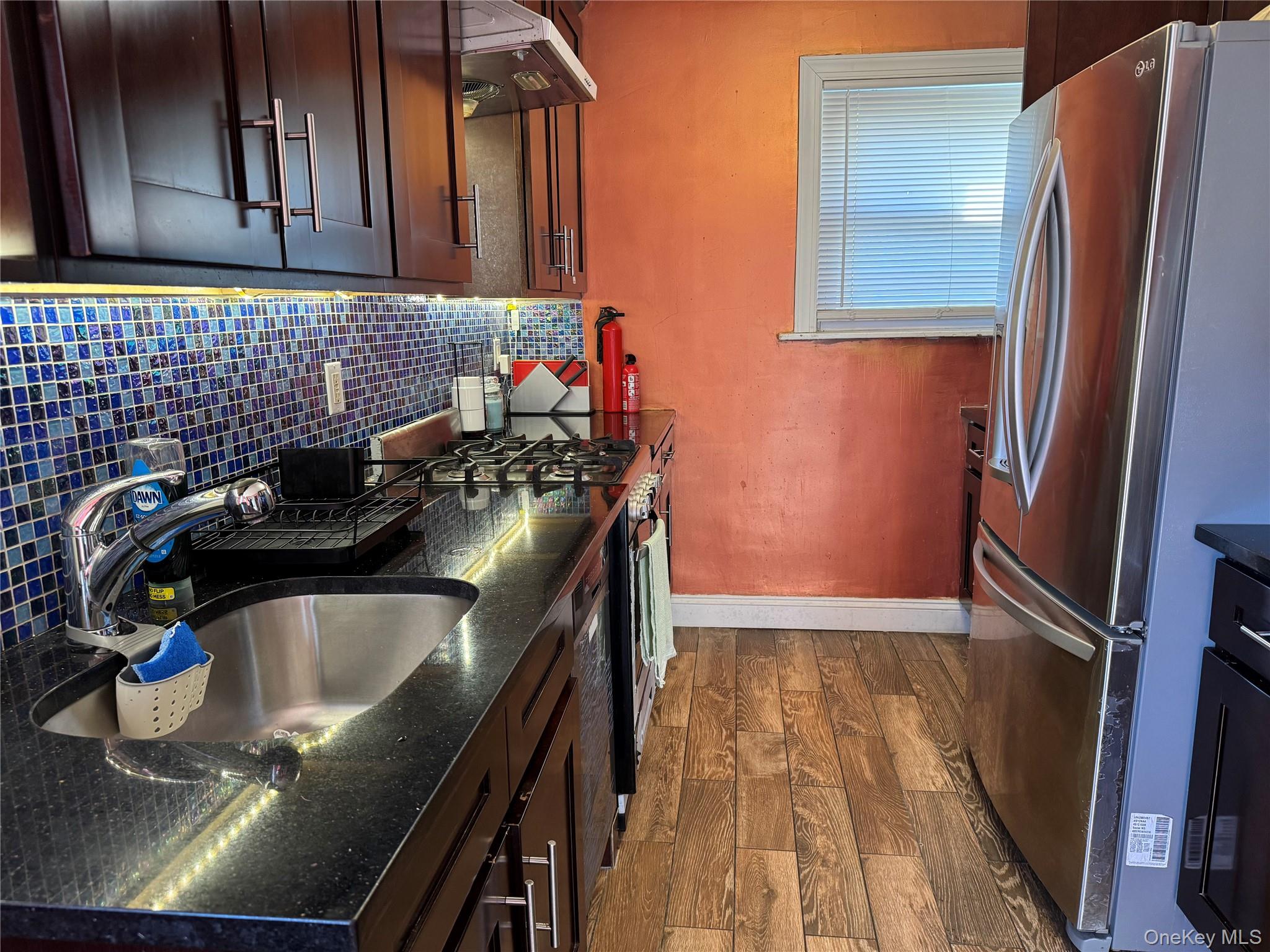 26 Parkside Drive Jericho, NY 11753 - Photo 14 of 25 a kitchen with a sink appliances and cabinets