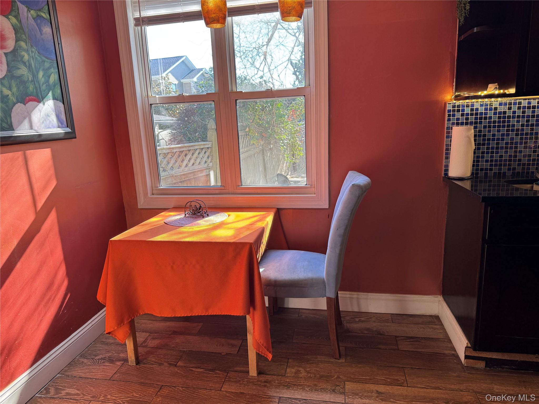 26 Parkside Drive Jericho, NY 11753 - Photo 16 of 25 a view of a dining room with furniture and wooden floor