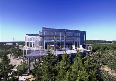 Undisclosed Address Wellfleet, MA 02667 - Photo 3 of 8 a view of a large building with a yard