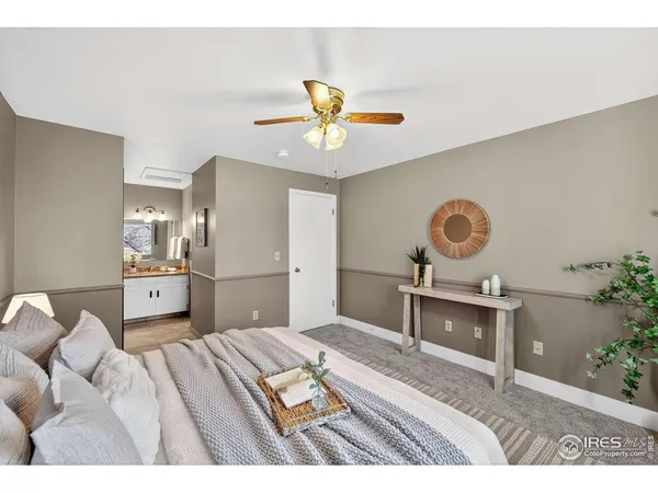 a bedroom with a bed and ceiling fan