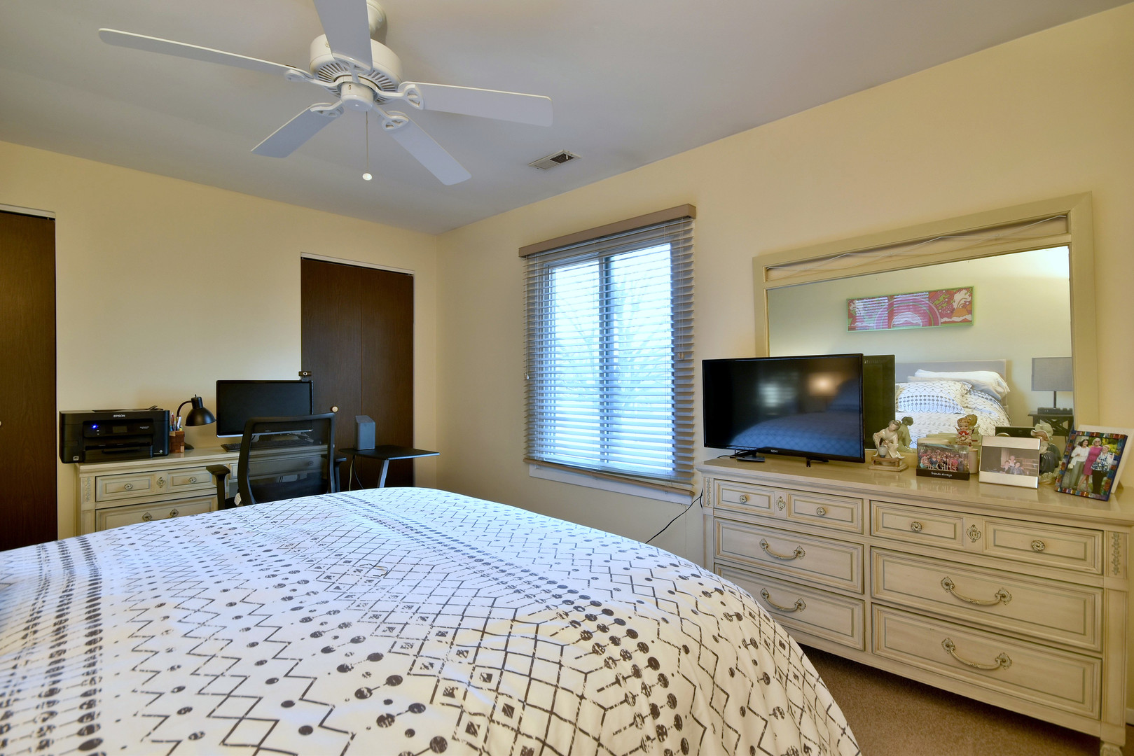 1652 Dover Court, Unit B Wheaton, IL 60189 - Photo 21 of 29 a bedroom with a bed and a flat screen tv in it