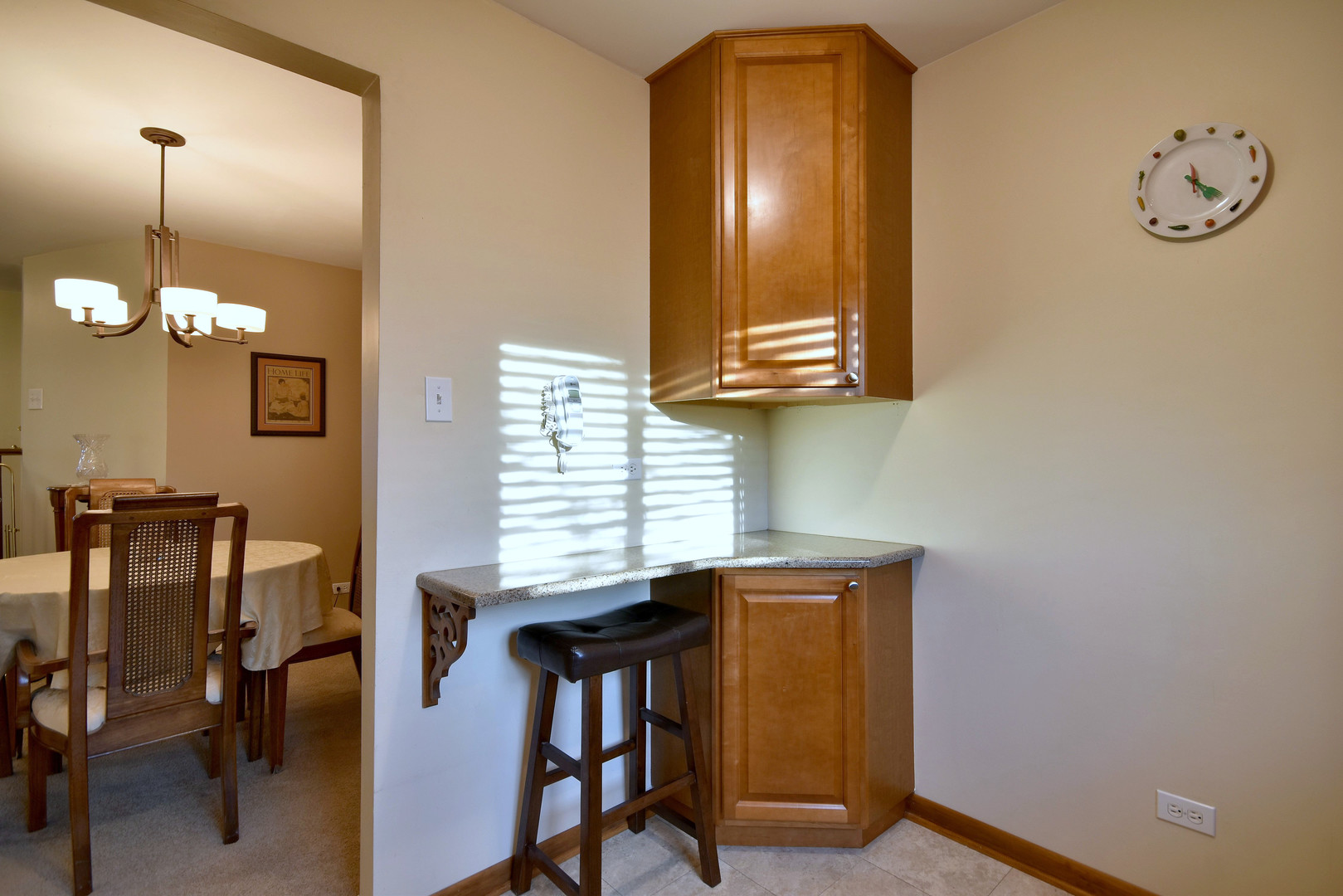 1652 Dover Court, Unit B Wheaton, IL 60189 - Photo 10 of 29 a view of a dining room with furniture and a chandelier