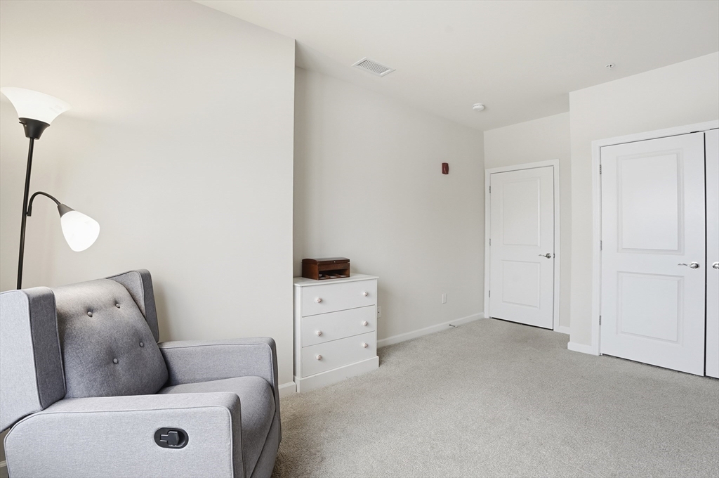 2306 Talbot Way, Unit 2306 Westborough, MA 01581 - Photo 19 of 37 a living room with furniture and a window