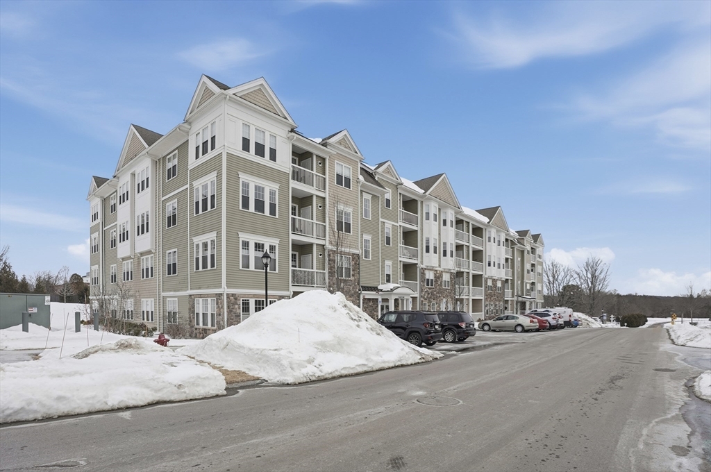 2306 Talbot Way, Unit 2306 Westborough, MA 01581 - Photo 35 of 37 a large building with a street in front of it