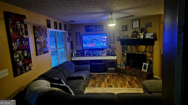 a living room with furniture and a fireplace