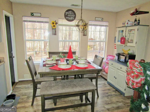 a outdoor dining space with furniture and window
