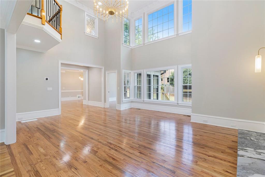 2820 Harwick Drive Atlanta, GA 30350 - Photo 13 of 48 a view of an empty room with wooden floor and a window