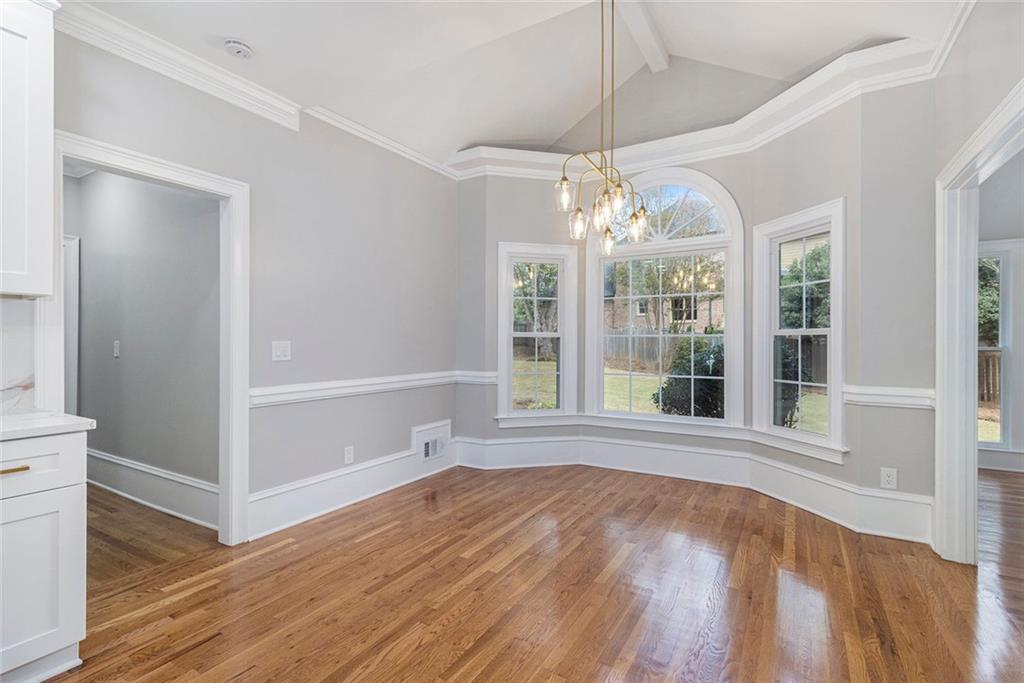 2820 Harwick Drive Atlanta, GA 30350 - Photo 15 of 48 a view of an empty room with wooden floor and a window