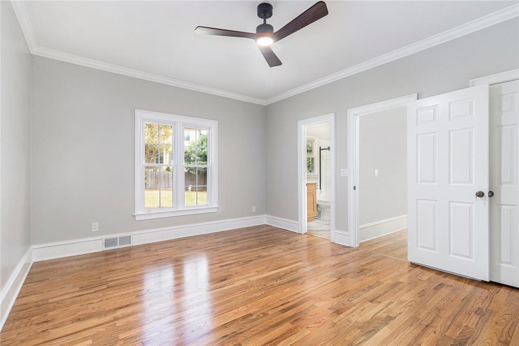 2820 Harwick Drive Atlanta, GA 30350 - Photo 20 of 48 a view of empty room with wooden floor and fan