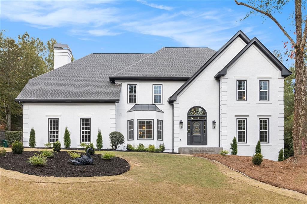 2820 Harwick Drive Atlanta, GA 30350 - Photo 2 of 48 a front view of a house with garden