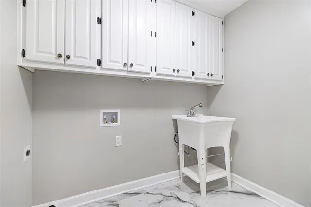 a bathroom with a toilet sink vanity and mirror