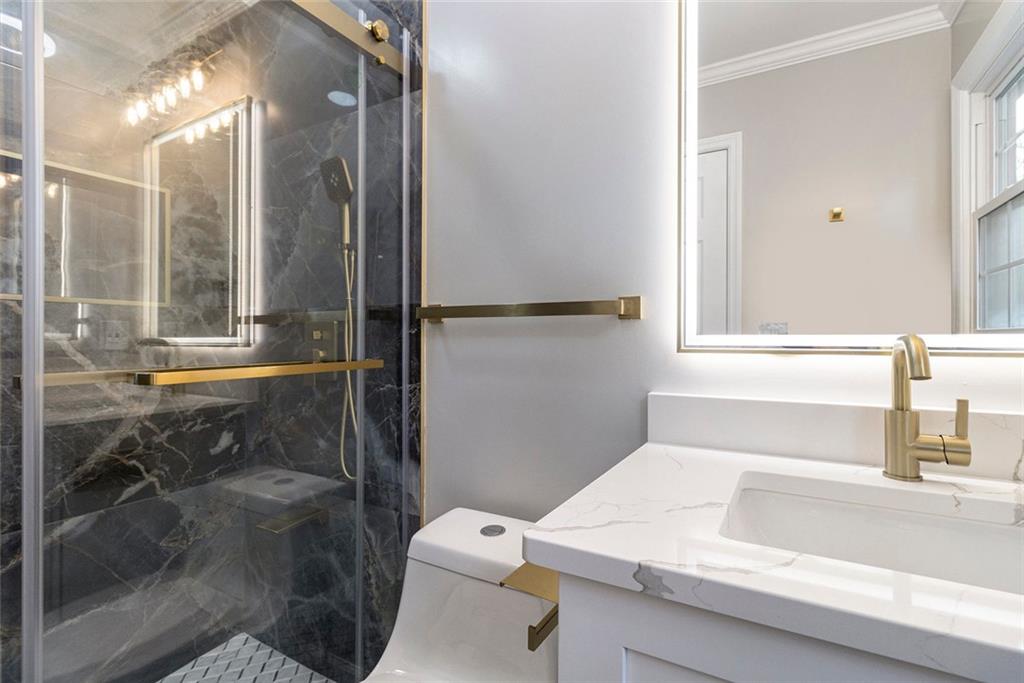 2820 Harwick Drive Atlanta, GA 30350 - Photo 30 of 48 a bathroom with a sink and a mirror