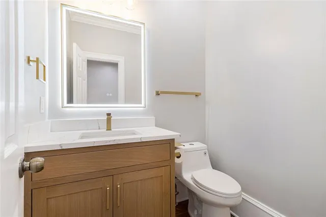 a view of a kitchen with a sink and a refrigerator