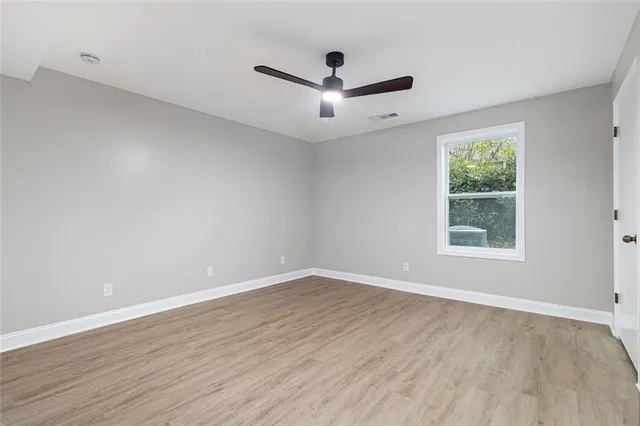 a view of a kitchen with wooden floor