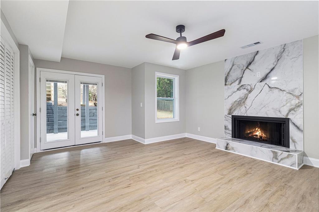 2820 Harwick Drive Atlanta, GA 30350 - Photo 34 of 48 a view of an empty room with wooden floor fireplace and a window