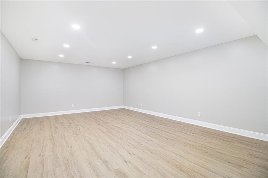 2820 Harwick Drive Atlanta, GA 30350 - Photo 37 of 48 a view of an empty room with wooden floor and a window