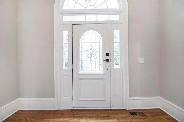 a view of entryway with wooden floor