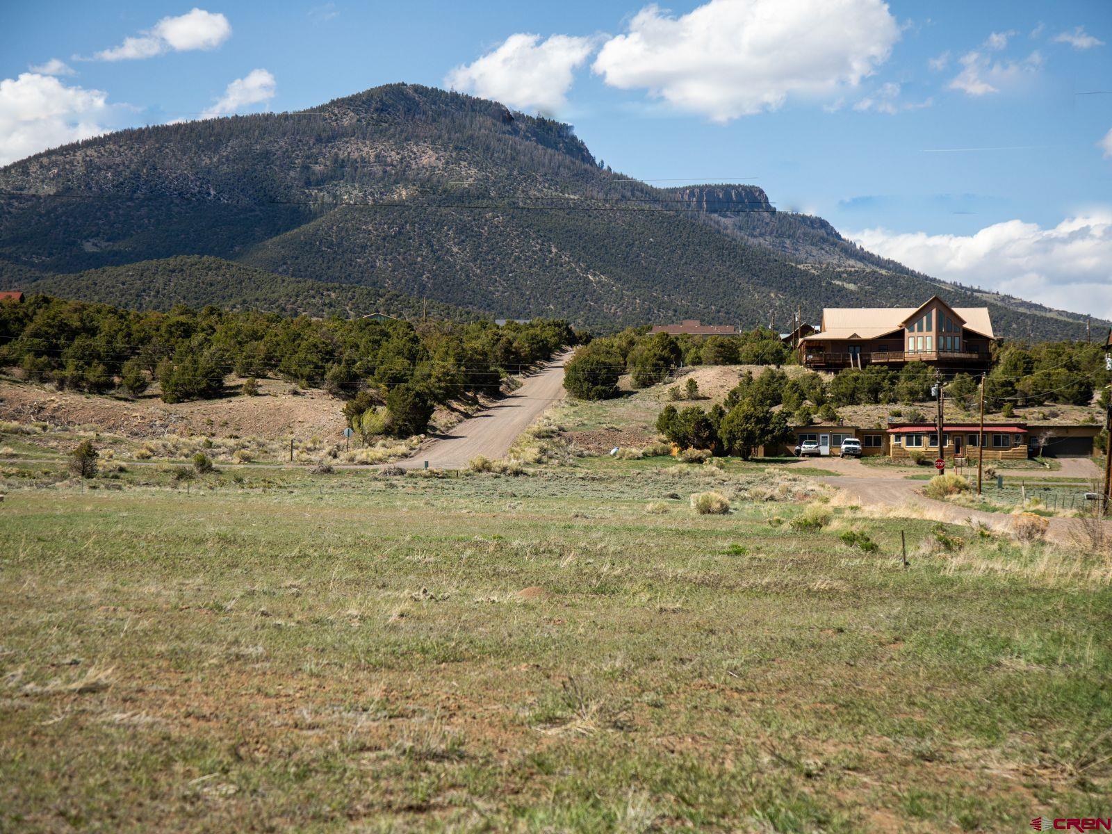127 Browns Road South Fork, CO 81154 - Photo 1 of 44 a view of a town with mountains in the background